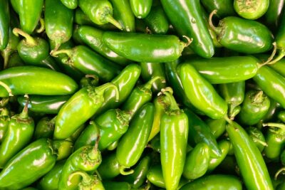green chili peppers in close up photography